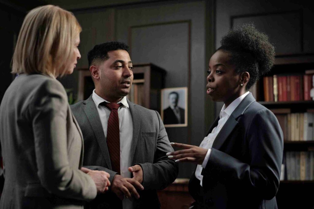 Three person talking about legal stuff